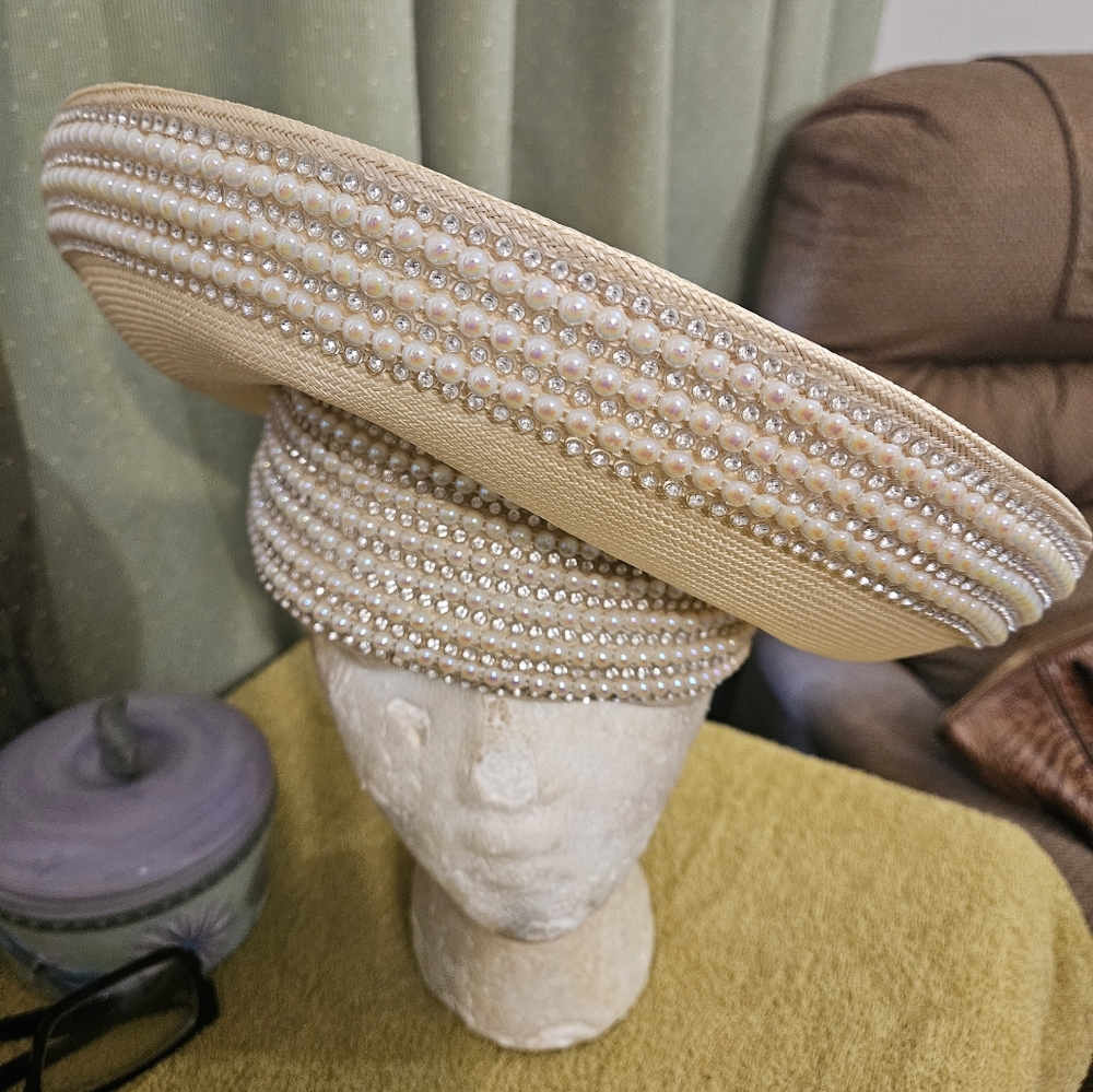 Beige church hat ventage.